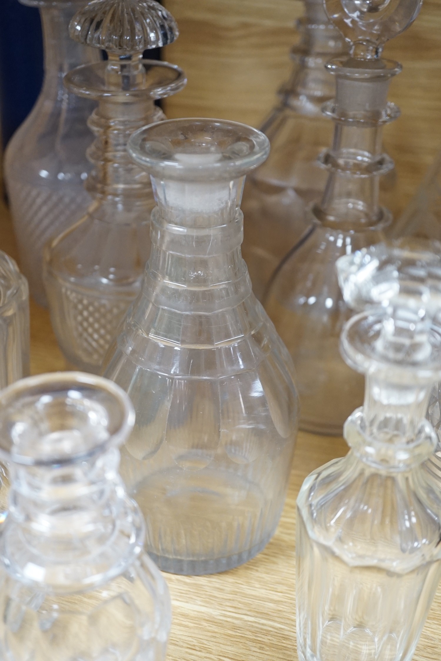 Twelve glass decanters and a carafe (13)